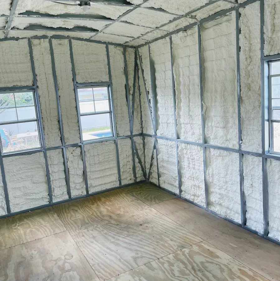 Closed-cell spray foam insulation applied to wall cavities in a residential project in Tysons